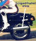 The scratched muffler areas which scrapped the pavement each time Cyrus corners on the Ninja bike