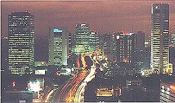 Jakarta, one of the world's 5 largest city, a skyline of part of this vast city of 12 million at night to 18 to 20 million during the day from commuters who clog up the internal and external toll roads sometimes until 10 pm.